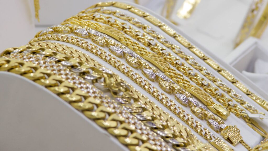 an image of 14k and 18k yellow gold jewelry on display