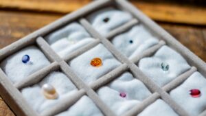 an image of various birthstones in a display piece on t a table