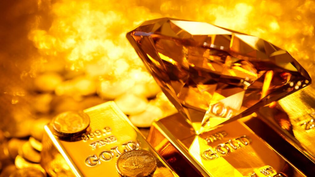 an image of a gold bar with gold coins and a big diamond sitting on top of the gold bar