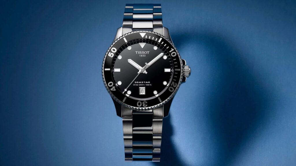 a display version of a tissot 1853 seastar stainless steel watch with black rotating bezel and a black dial